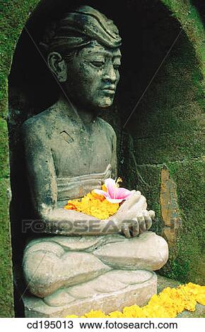 Statue and offerings in temple. Ubud. Bali. Indonesia View Large Photo Image Stock Image - Statue and offerings in temple. Ubud. Bali. Indonesia. Fotosearch