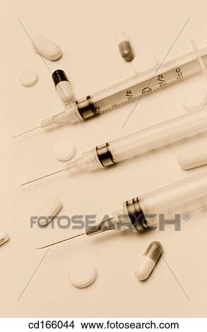 Syringes and pills View Large Photo Image Picture - Syringes and pills. Fotosearch