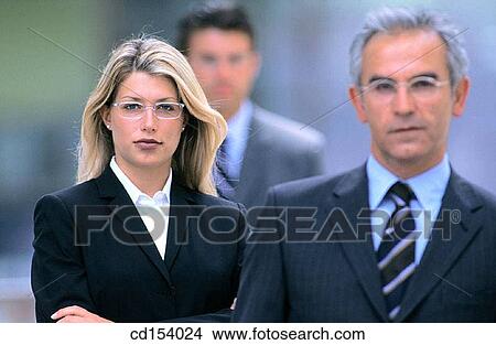 Three businesspeople looking at camera View Large Photo Image Picture - Three businesspeople looking at camera. Fotosearch