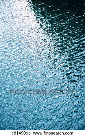 Tight view of ripple water shapes on a stand of water. View Large Photo Image Stock Photography - Tight view of ripple water shapes on a stand of water.. Fotosearch