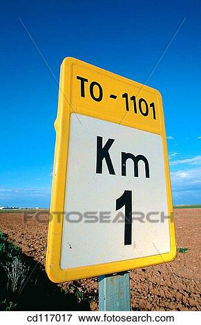 Stock Photo - Traffic sign at road giving information about distances near the village El Toboso. Toledo province. Spain. Fotosearch