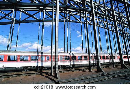 Train crossing bridge over Rhine River. Cologne. Germany View Large Photo Image Stock Photo - Train crossing bridge over Rhine River. Cologne. Germany. Fotosearch