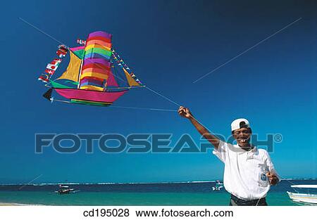Vendor selling kites. Sanur Beach. Bali. Indonesia View Large Photo Image Stock Photo - Vendor selling kites. Sanur Beach. Bali. Indonesia. Fotosearch