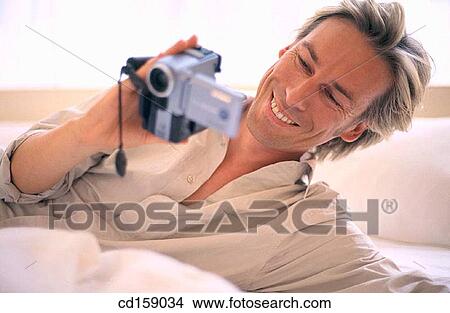 Video camera, Joy, Happy View Large Photo Image Picture - Video camera, Joy, Happy. Fotosearch