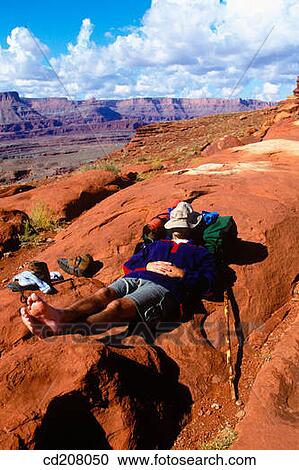 A backpacker resting near Moab, Utah, USA View Large Photo Image Stock Image - A backpacker resting near Moab, Utah, USA. Fotosearch