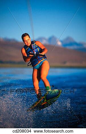 Picture - A woman wake boarding. Fotosearch