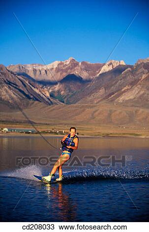 A woman wake boarding View Large Photo Image Stock Image - A woman wake boarding. Fotosearch