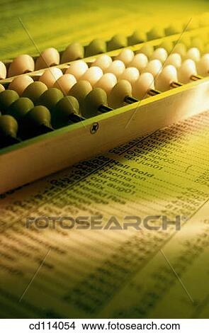 Abacus on stock page View Large Photo Image Picture - Abacus on stock page. Fotosearch
