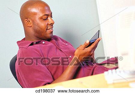agenda, calculator, business, black, African-American View Large Photo Image Stock Photo - agenda, calculator, business, black, African-American. Fotosearch
