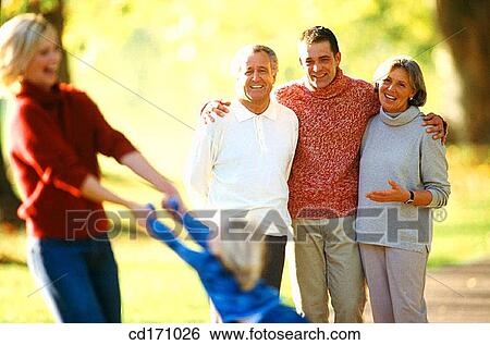 Stock Photograph - amusement, contemporary, child, 3 generations. Fotosearch