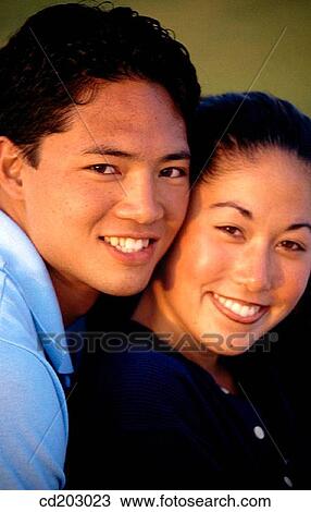 Stock Image - Asian-American, bonding, bond, Best friend, adolescence. Fotosearch