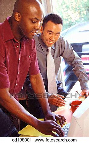 Stock Image - Asian-American, businessman, business, black, African-American. Fotosearch