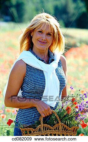 Stock Photo - baby boomer, basket, blond. Fotosearch