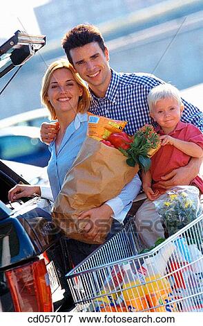 Stock Photo - bag, car park, car, boy, automobile. Fotosearch