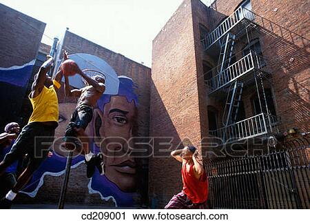 Basketball player attempts a reverse slam dunk on a street court View Large Photo Image Stock Image - Basketball player attempts a reverse slam dunk on a street court. Fotosearch