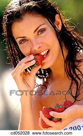 beauty, brunette, biting, bite, action View Large Photo Image Stock Photo - beauty, brunette, biting, bite, action. Fotosearch
