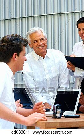 Stock Image - boss, business, collaboration, colleague. Fotosearch