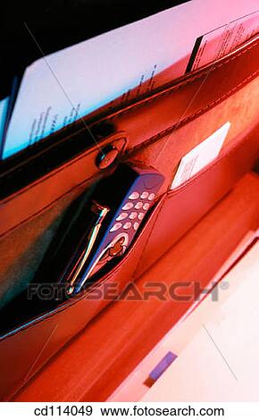 Briefcase, cell phone View Large Photo Image Stock Photo - Briefcase, cell phone. Fotosearch