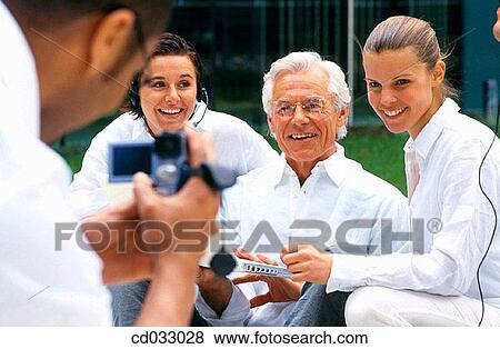 Stock Photo - business, contemporary, camcorder, amusement. Fotosearch