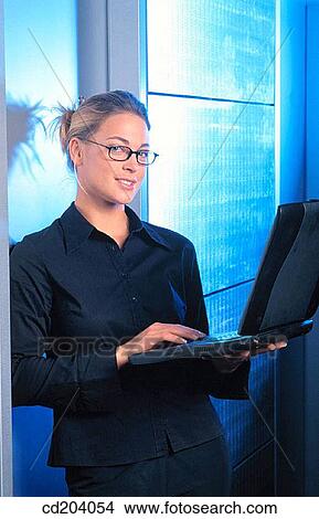 Businesswoman with laptop View Large Photo Image Picture - Businesswoman with laptop. Fotosearch