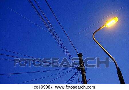 Stock Photo - City lamp at dusk. Fotosearch