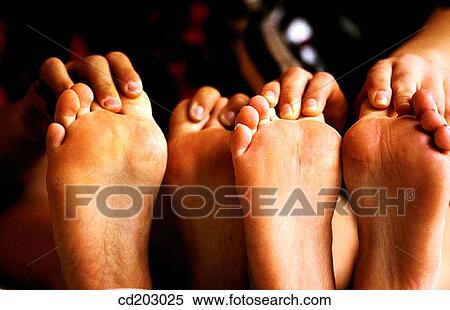 Stock Photography - Close-up, amusing, boy, barefoot, anonymous, adolescence. Fotosearch