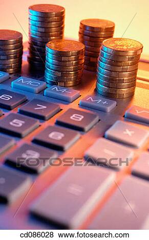 Coins and electronic calculator View Large Photo Image Stock Photo - Coins and electronic calculator. Fotosearch