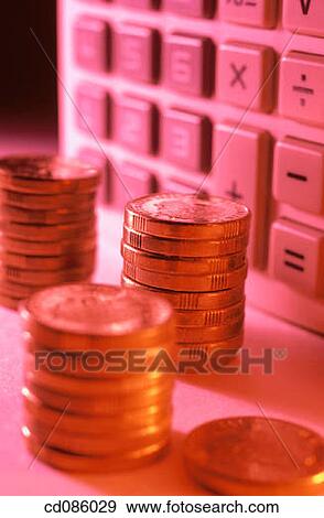 Coins and electronic calculator View Large Photo Image Stock Photo - Coins and electronic calculator. Fotosearch