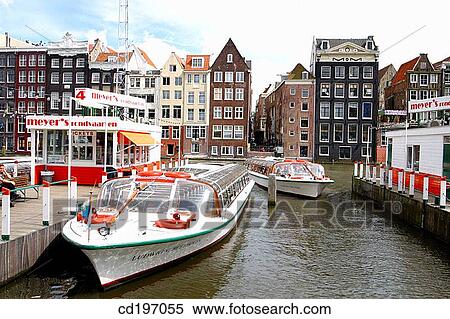 Cruise boats at Damrak. Amsterdam. Holland View Large Photo Image Stock Photography - Cruise boats at Damrak. Amsterdam. Holland. Fotosearch