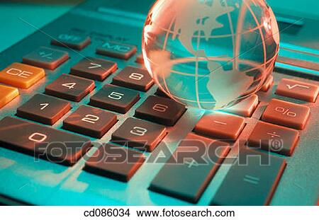 Crystal globe on electronic calculator View Large Photo Image Picture - Crystal globe on electronic calculator. Fotosearch