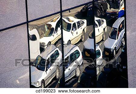 Distorted reflection of cars in glass wall View Large Photo Image Stock Image - Distorted reflection of cars in glass wall. Fotosearch