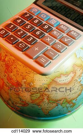 Electronic calculator on globe View Large Photo Image Stock Photo - Electronic calculator on globe. Fotosearch