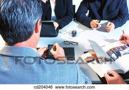 Stock Photograph - Executives in conference. Fotosearch