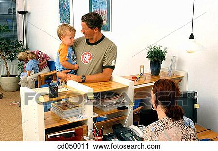 Father and son at the doctor's office View Large Photo Image Stock Image - Father and son at the doctor's office. Fotosearch