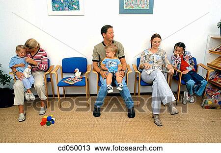 Father and son at the doctor's office View Large Photo Image Stock Image - Father and son at the doctor's office. Fotosearch