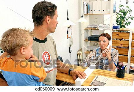 Father and son at the doctor's office View Large Photo Image Stock Photo - Father and son at the doctor's office. Fotosearch