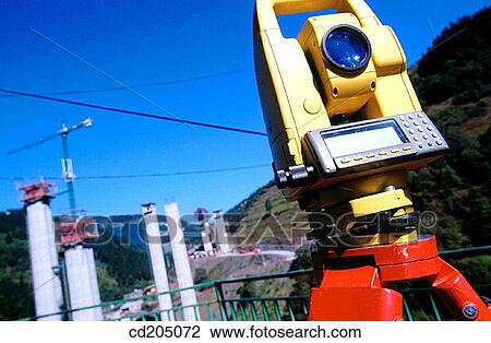 Stock Image - Freeway bridge construction, topographic station. Fotosearch