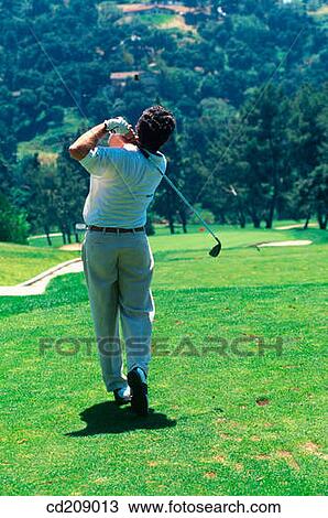 Golfer drives View Large Photo Image Stock Image - Golfer drives. Fotosearch