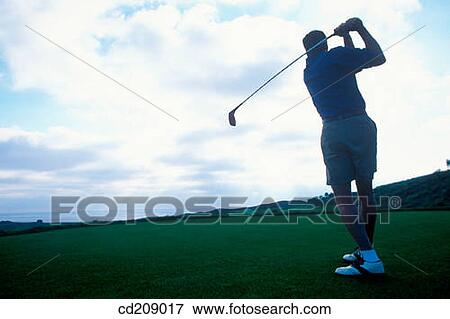 Stock Photo - Golfer driving. Fotosearch