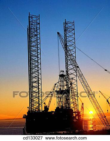 Stock Photo - Jack-up oil rig at sunrise. Scotland. Fotosearch