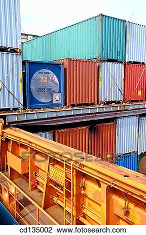 Stock Image - Loading cargo containers on a ship. Port of Bilbao. Biscay. Basque Country. Spain. Fotosearch
