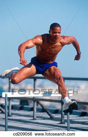 Stock Photograph - Man hurdling. Fotosearch