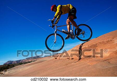 Man mountain biking near Moab, Utah, USA View Large Photo Image Stock Image - Man mountain biking near Moab, Utah, USA. Fotosearch