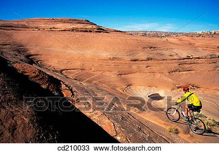 Man mountain biking near Moab, Utah, USA View Large Photo Image Stock Image - Man mountain biking near Moab, Utah, USA. Fotosearch