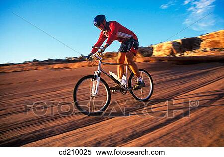 Man mountain biking near Moab, Utah, USA View Large Photo Image Stock Photography - Man mountain biking near Moab, Utah, USA. Fotosearch