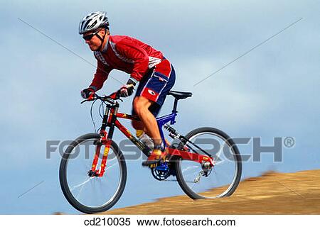 Man mountain biking View Large Photo Image Stock Photography - Man mountain biking. Fotosearch