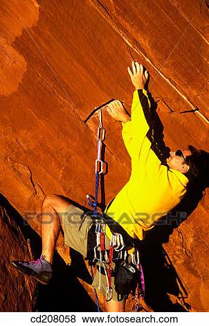 Rock climbing near Moab, Utah, USA View Large Photo Image Stock Photo - Rock climbing near Moab, Utah, USA. Fotosearch
