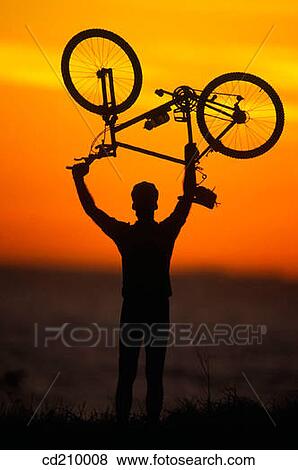 Silhouette of a mountain biker View Large Photo Image Stock Photo - Silhouette of a mountain biker. Fotosearch
