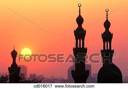Sunset on Hassan Mosque minarets. Cairo. Egypt View Large Photo Image Stock Photo - Sunset on Hassan Mosque minarets. Cairo. Egypt. Fotosearch