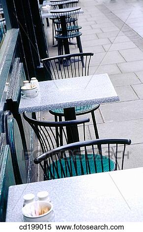 Stock Photography - Tables on footpath outside coffee shop. Fotosearch